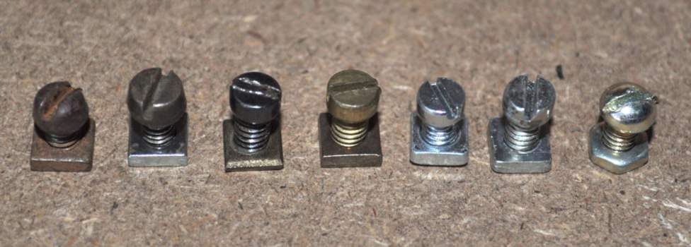 Bolts L–R: Domed; Coned; Cheese head, Japanned; Cheese head, plated; Small cheese head, steel (not a set-screw); Cheese head, steel; Domed head, plated (from Meccanoids set, c. 1979)