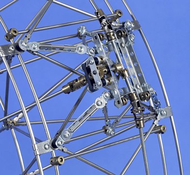Figure 6: The capsule mounting frame with radial and circumferential drive arrangements — the four collars are the capsule attachment points