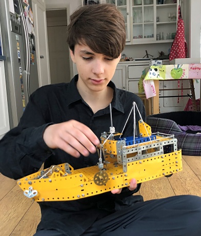 Figure 8: Luka with a Meccano model of a boat