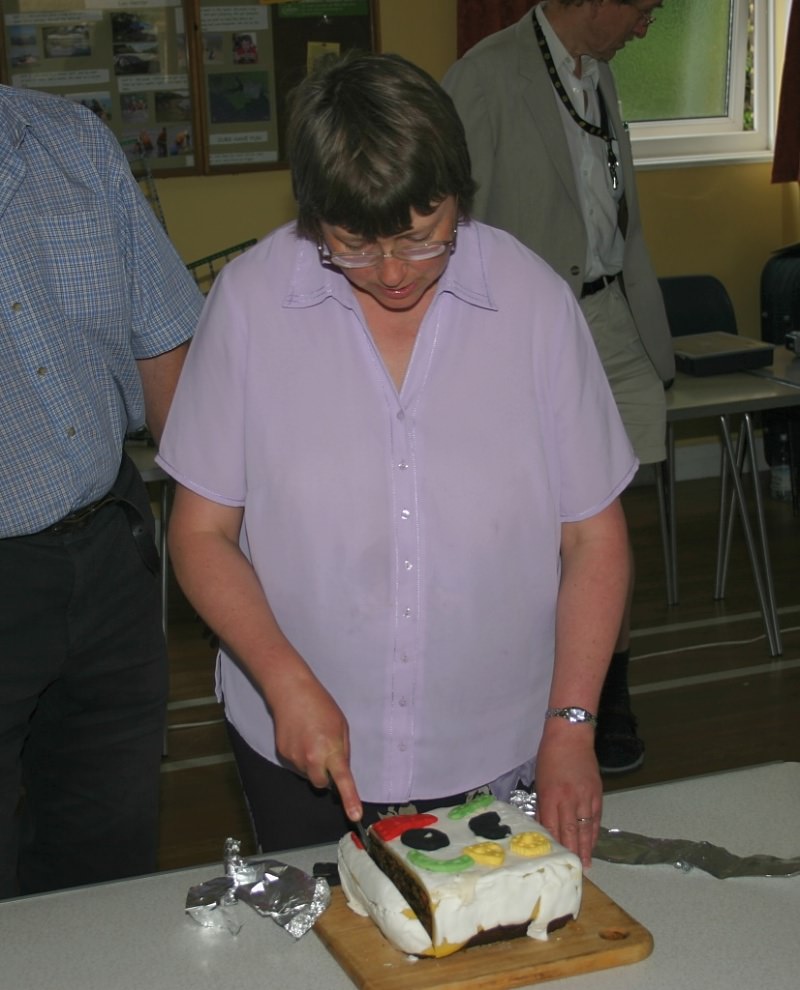 Cathy Warrell cutting the 30th anniversary cake on 24th June 2006