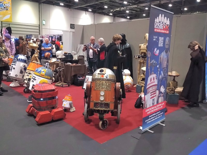 A collection of Star Wars robots, including the steampunk R2-D2 in the foreground
