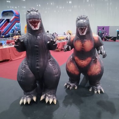 Brian Leach dressed as Godzilla (left)