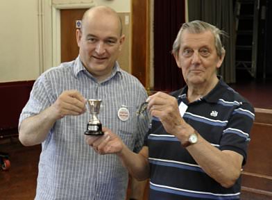 Ralph Laughton (left) awards the Cup to Eric Smith